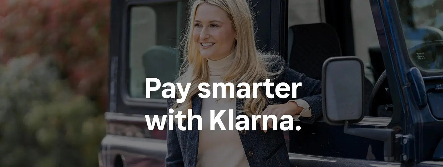 Smiling woman in vehicle window promoting Klarna, a leading payment provider.