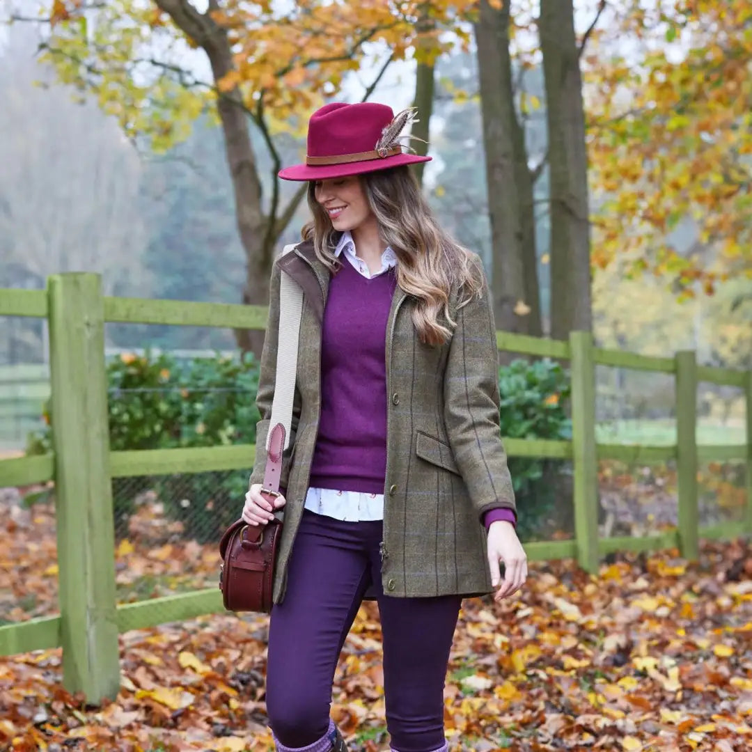 Woman in Alan Paine Combrook Field Jacket and burgundy hat enjoying fall outdoors