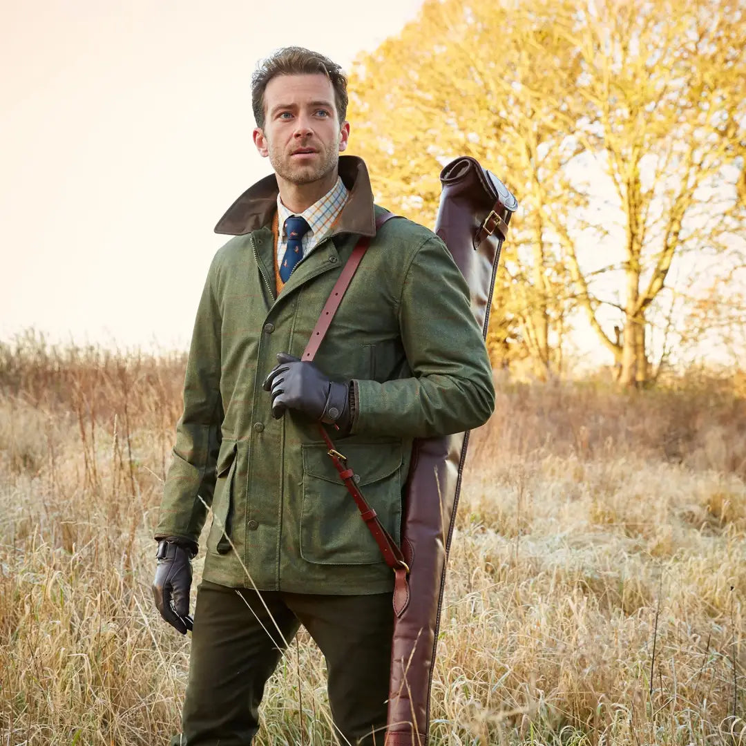 Man in hunting attire with Alan Paine Didsmere Coat featuring faux fur lining