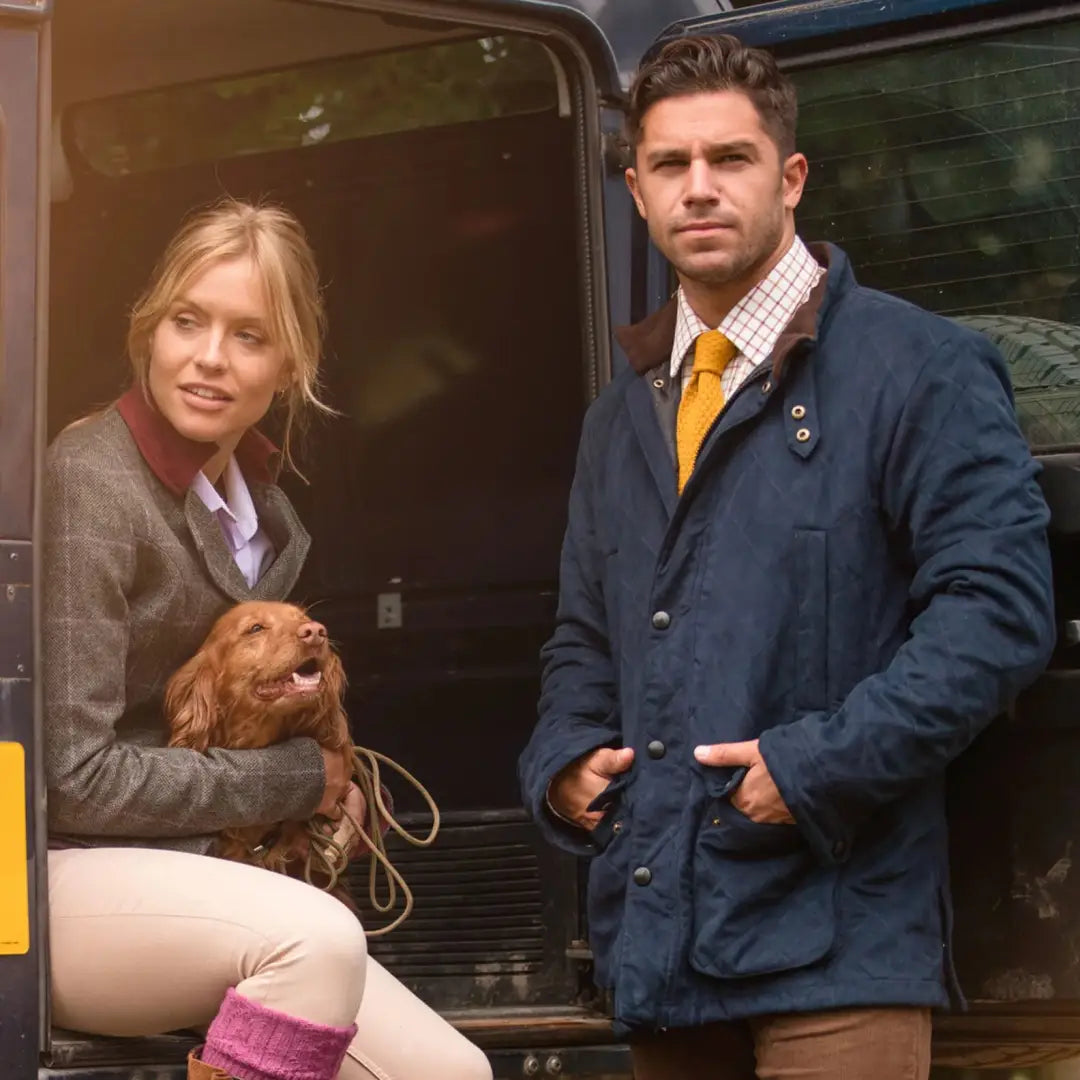 Two people and a dog in a vehicle doorway showcasing Alan Paine Felwell Jacket