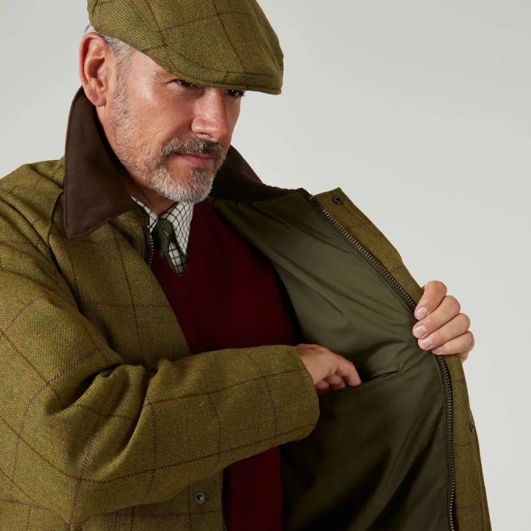 Olive green quilted jacket over red sweater, ties perfectly with Alan Paine Rutland Waterproof Tweed