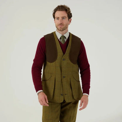 Man in a stylish layered outfit with Alan Paine Rutland Waistcoat and jumper