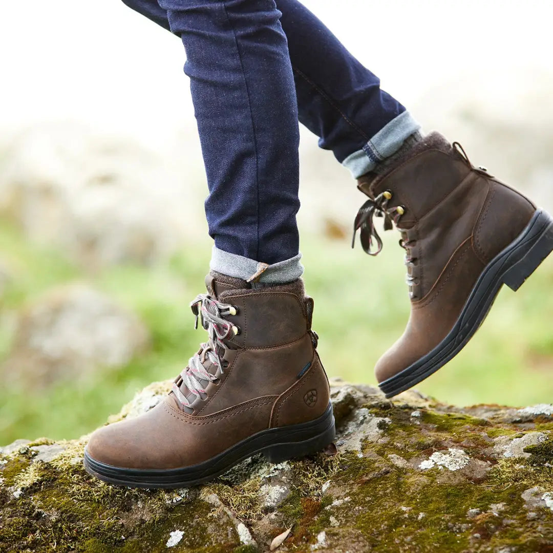 Brown leather Ariat Harper Waterproof Boots on rocky terrain for outdoor adventures