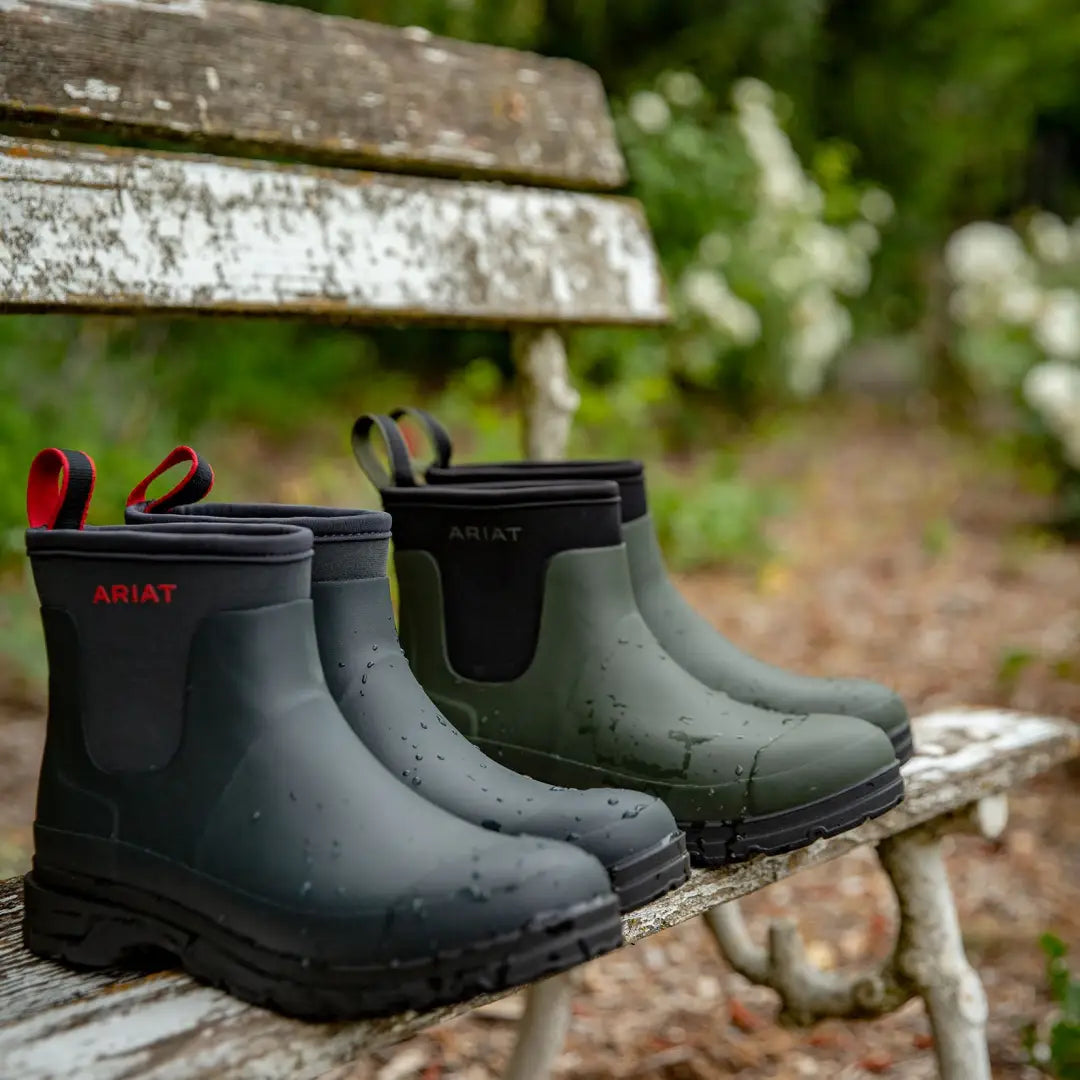 Ariat Kelmarsh Shortie Rubber Boots on a wooden surface, perfect for country clothing and hunting