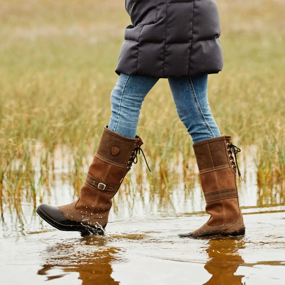 Ariat Ladies Langdale Waterproof Boots splashing in shallow water with jeans