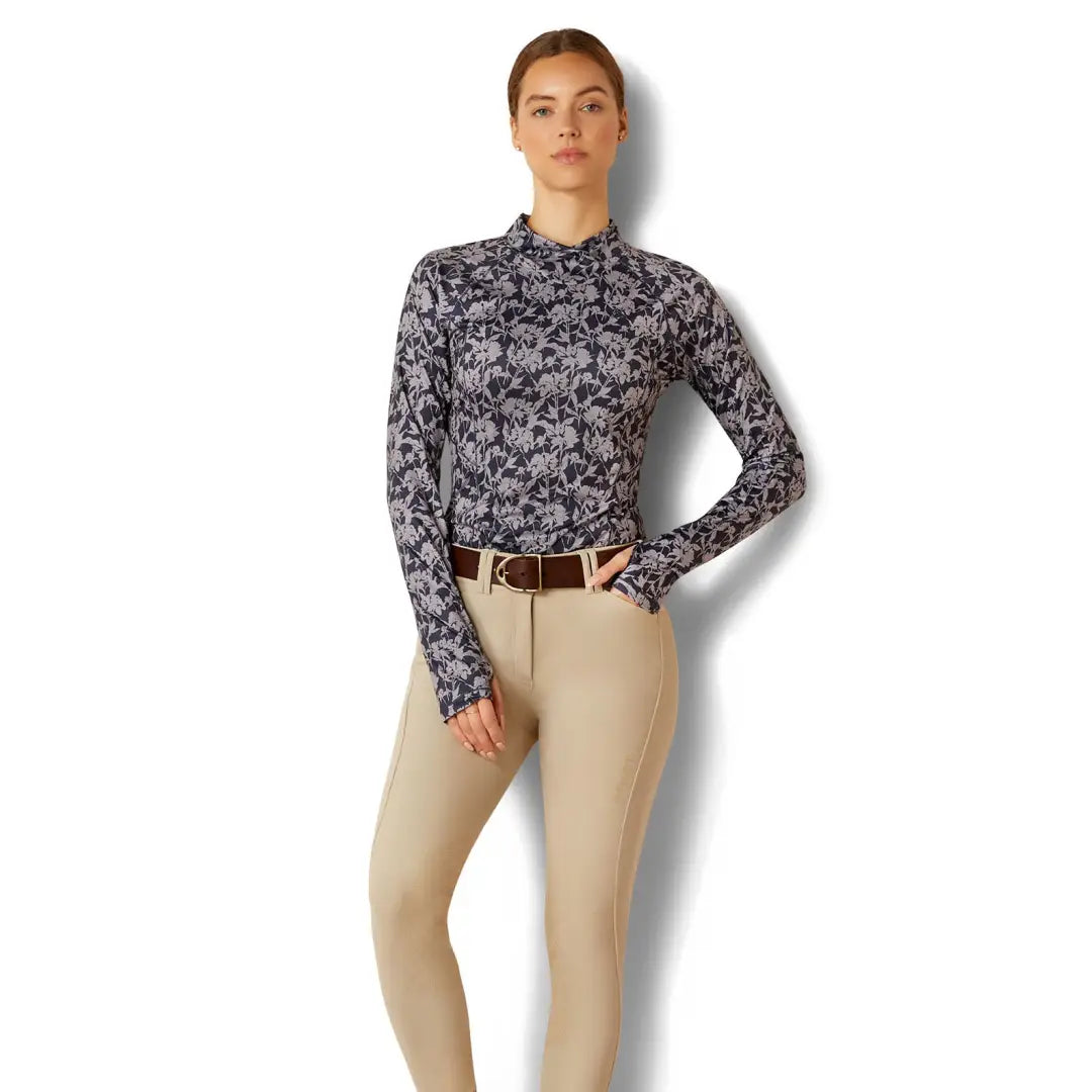 Woman in floral print turtleneck and beige pants, perfect for country clothing adventures