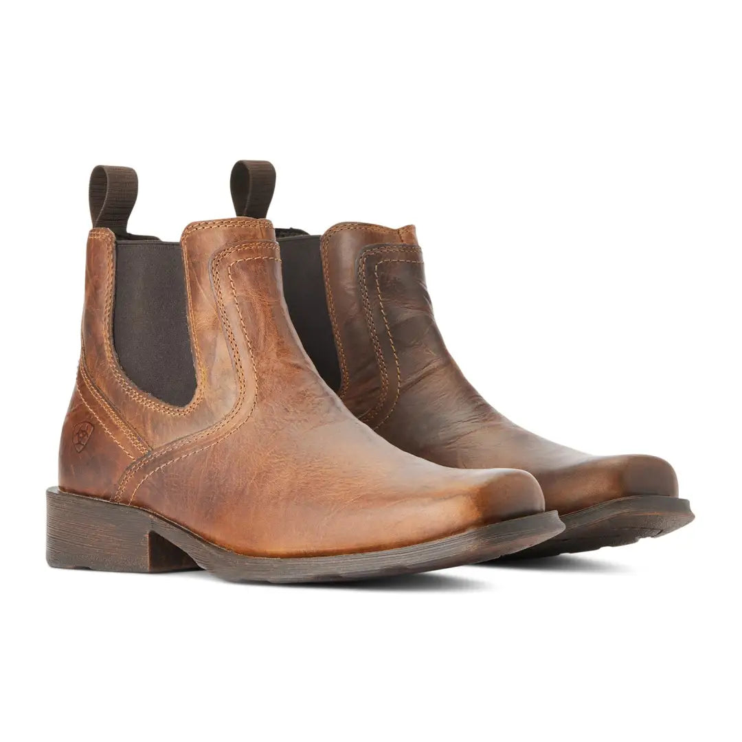 Brown leather Chelsea boots with elastic sides, perfect for country clothing and outdoors