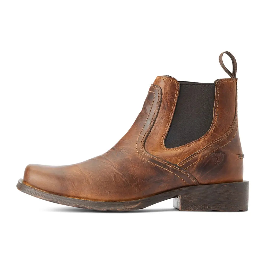 Brown leather Chelsea boot with square toe, perfect for country clothing and outdoor adventures