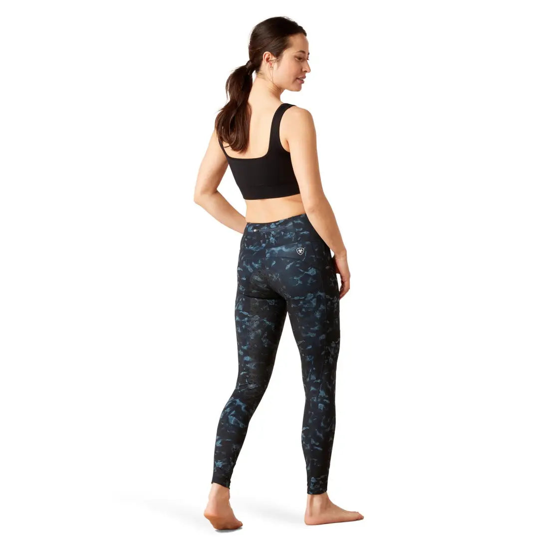 Woman in patterned leggings and black crop top rocking Ariat Womens EOS Print Full Seat Tights