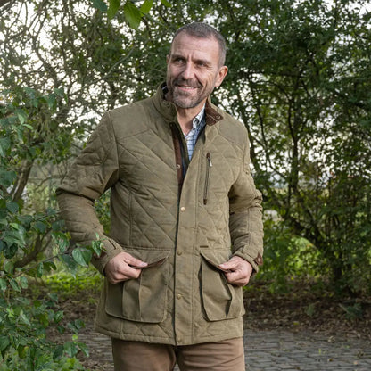 Middle-aged man in a Baleno Goodwood coat, featuring a stylish quilted jacket look