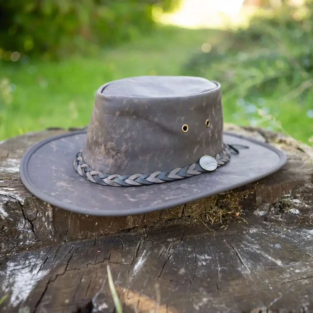 Weathered Barmah Squashy Roo Leather Hat in lightweight kangaroo leather on wooden surface