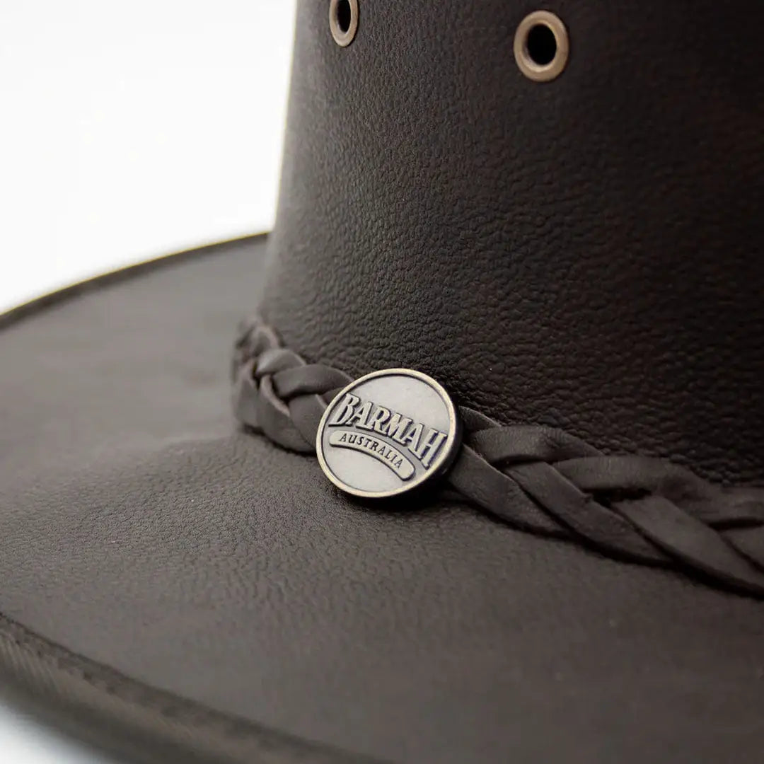 Black leather cowboy hat featuring a braided band and metal pin made from lightweight kangaroo leather