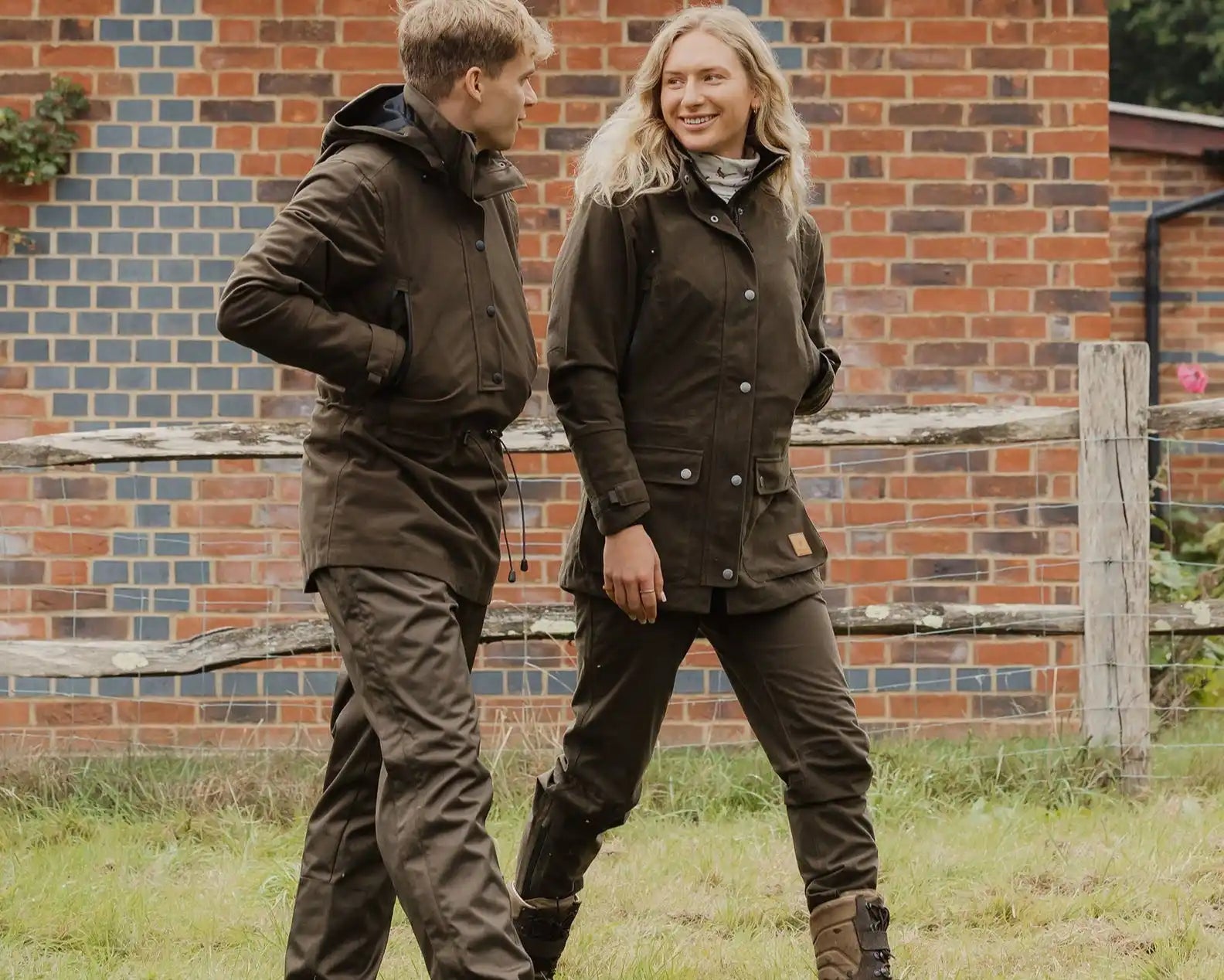 Matching brown outdoor jackets and pants.