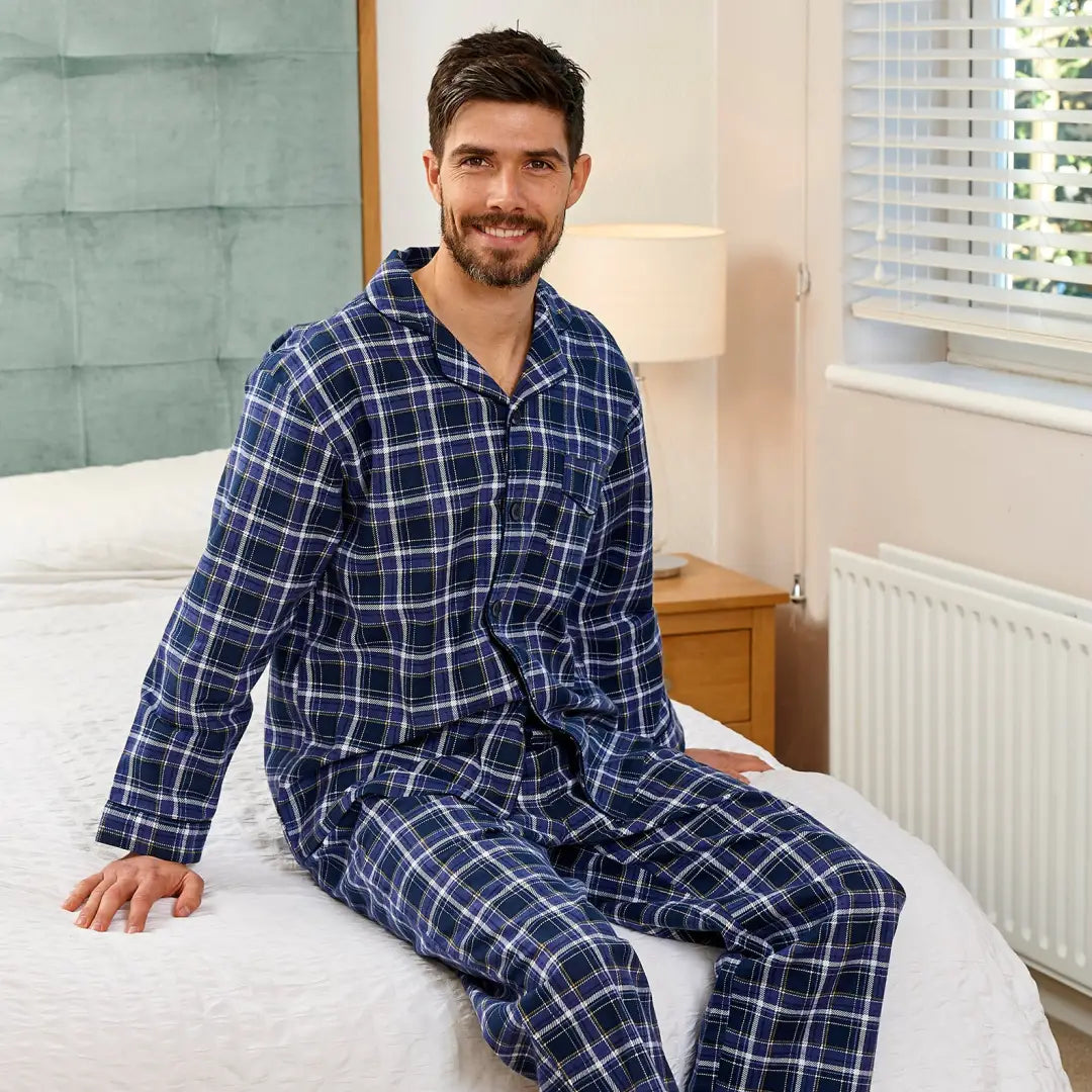 Smiling man in Navy and white plaid wearing Champion Cambridge Pyjamas