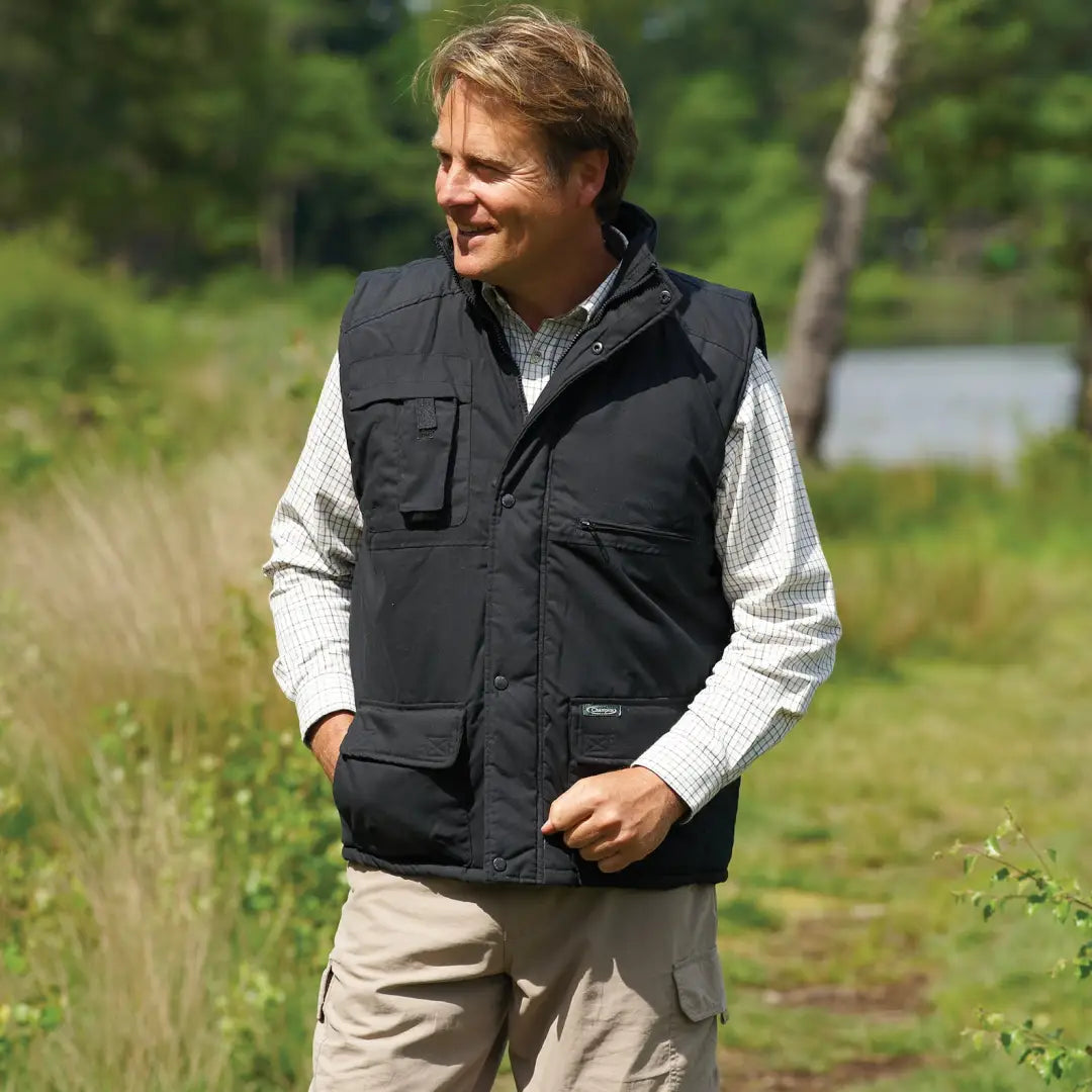 Black multi-pocketed Champion Peak Bodywarmer over a white shirt for stylish outdoor comfort