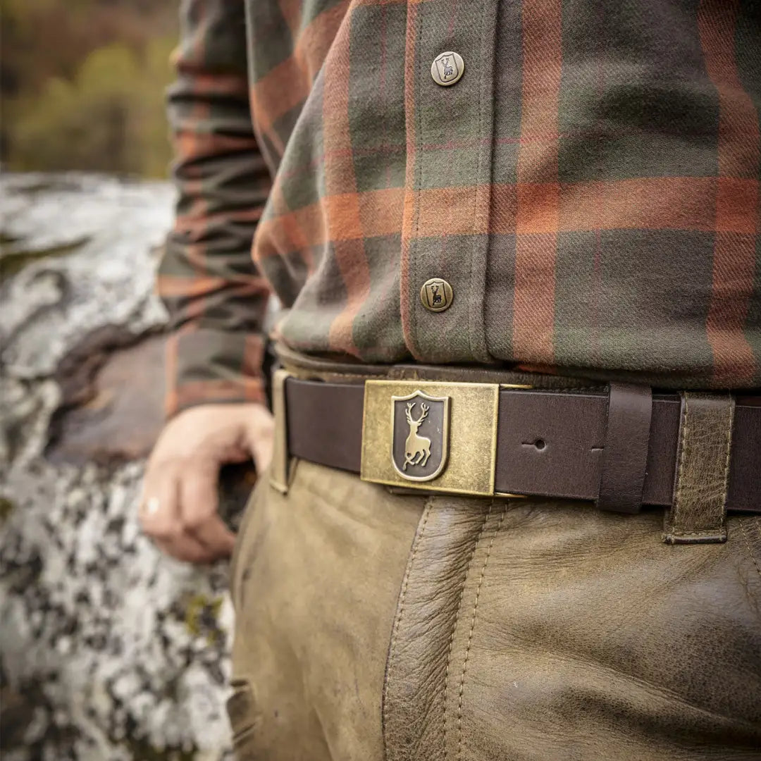 Belt buckle with shield emblem on Deerhunter Adjustable Leather Belt, stylish and durable