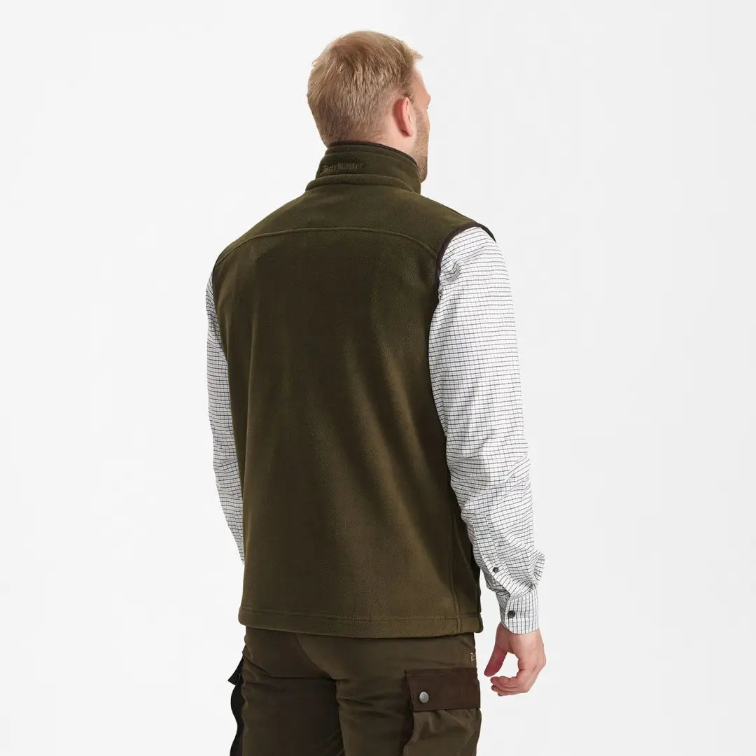 Olive green fleece waistcoat over a light patterned shirt, perfect for layering