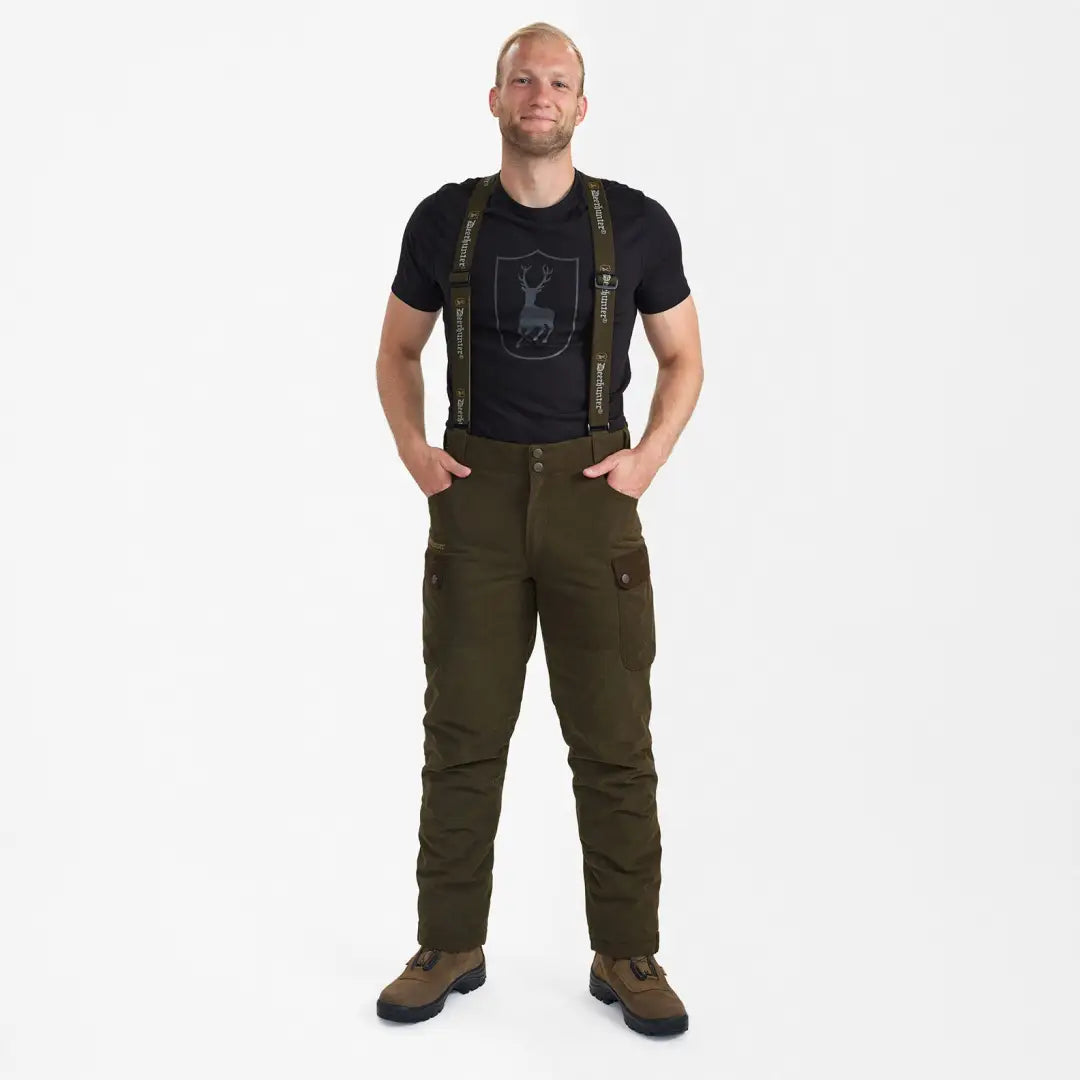 Man in black t-shirt and olive cargo pants showcasing Eagle Winter Trousers