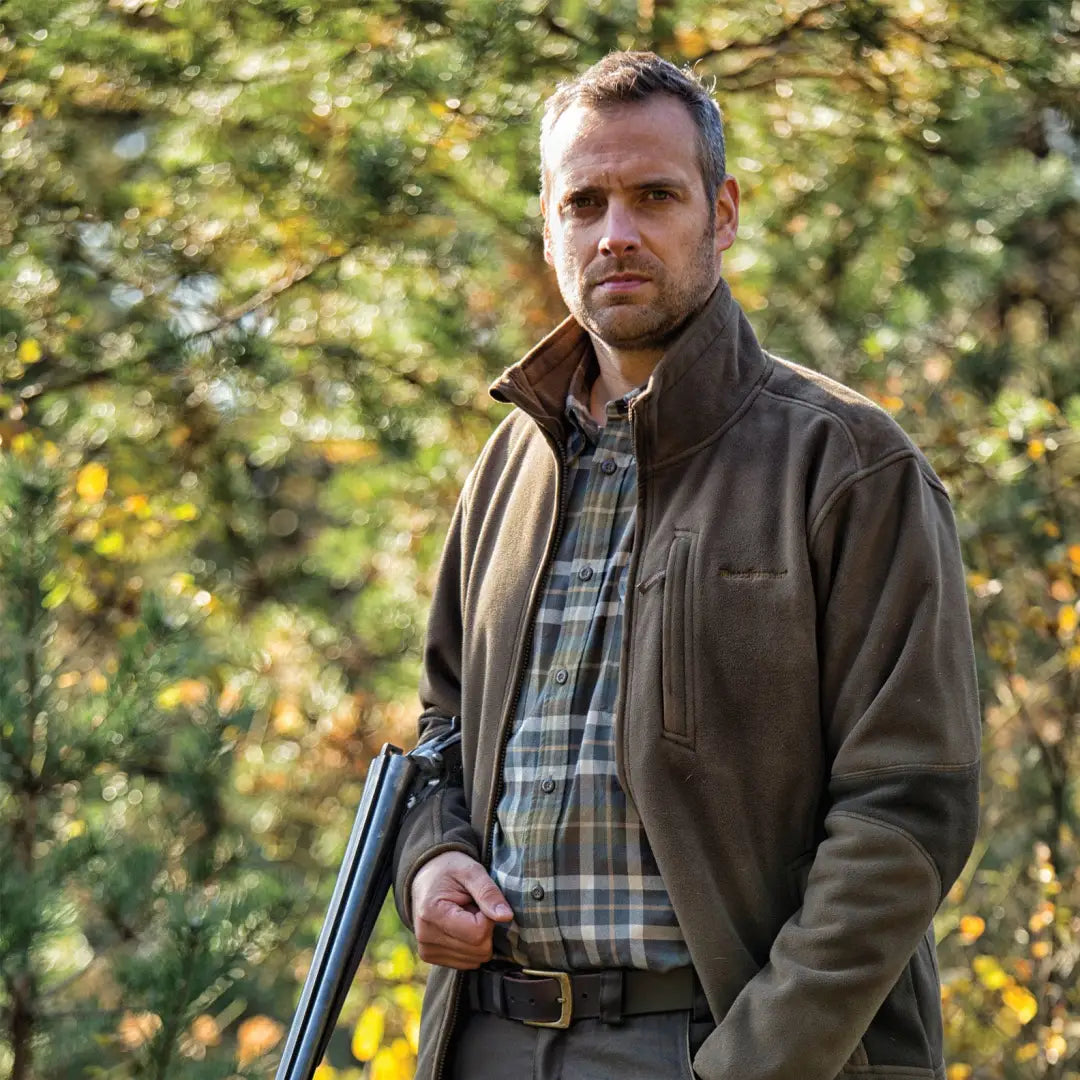 Man in outdoor clothing with shotgun wearing Deerhunter Gamekeeper Bonded Fleece Jacket