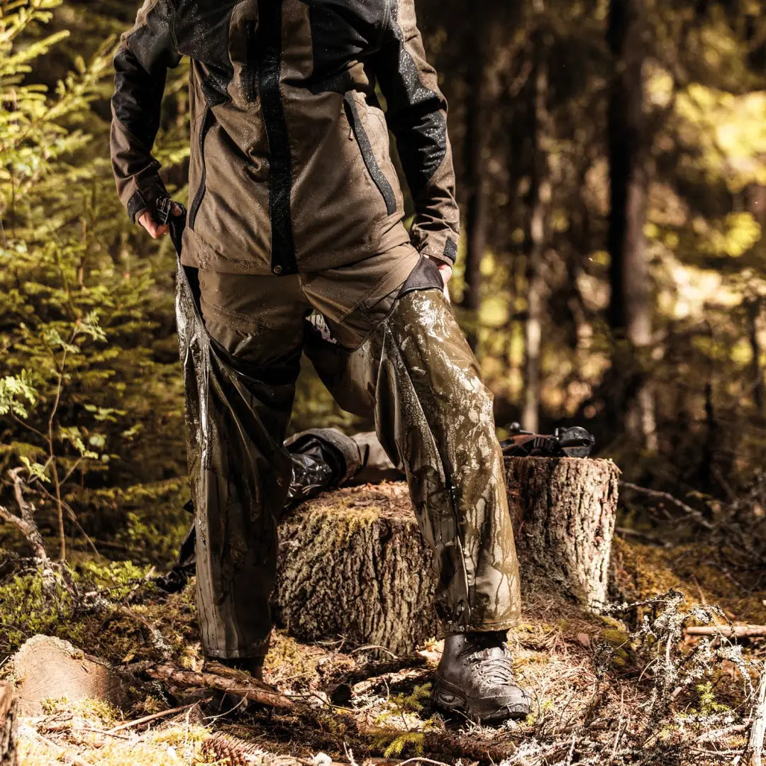 Rugged Deerhunter Hurricane Pull-over Trousers in a forest with handy pockets