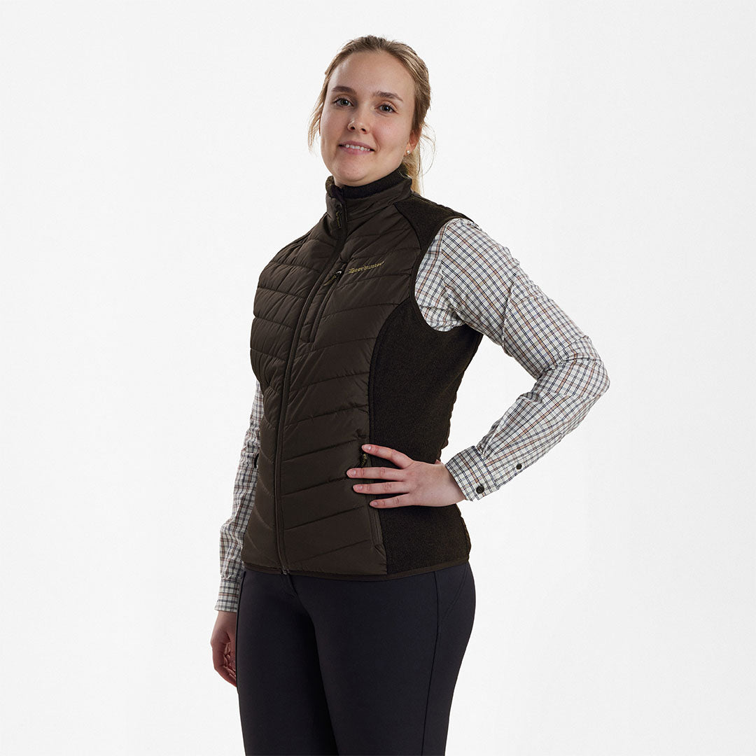 Woman wearing a stylish brown Deerhunter Lady Caroline Padded Waistcoat, perfect for fall