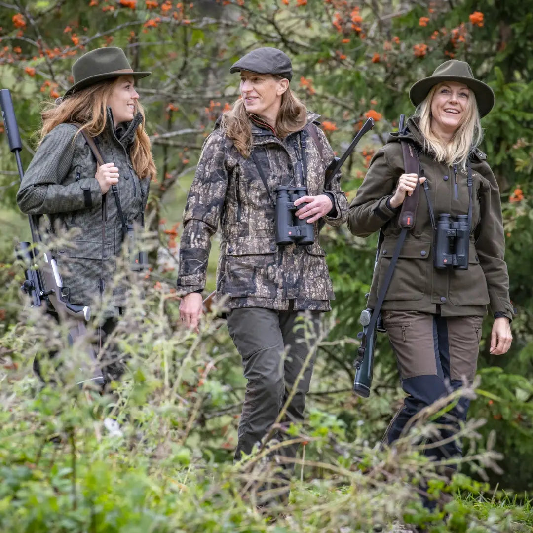 Three women in outdoor gear with binoculars and rifles love their Lady Gabby Jacket