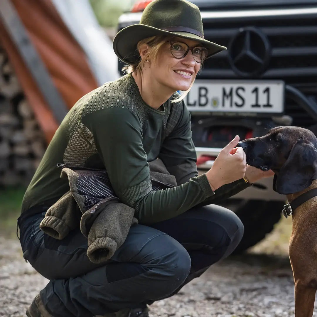 Woman in outdoor clothing with a dog, wearing Deerhunter Lady underwear set for country clothing