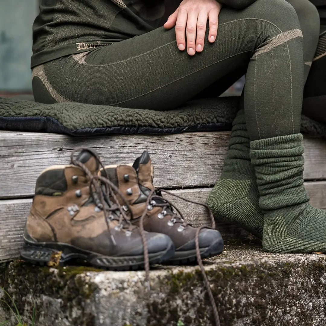 Rugged brown hiking boots on stone, perfect for country clothing and Deerhunter underwear set