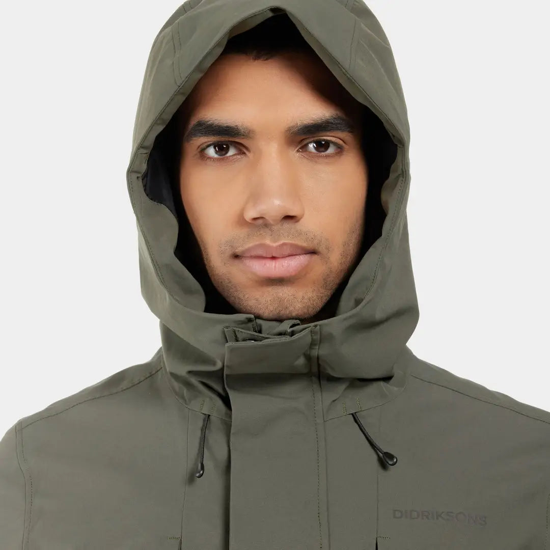 Olive green Didriksons Falke Parka features practical pockets and a stylish hood