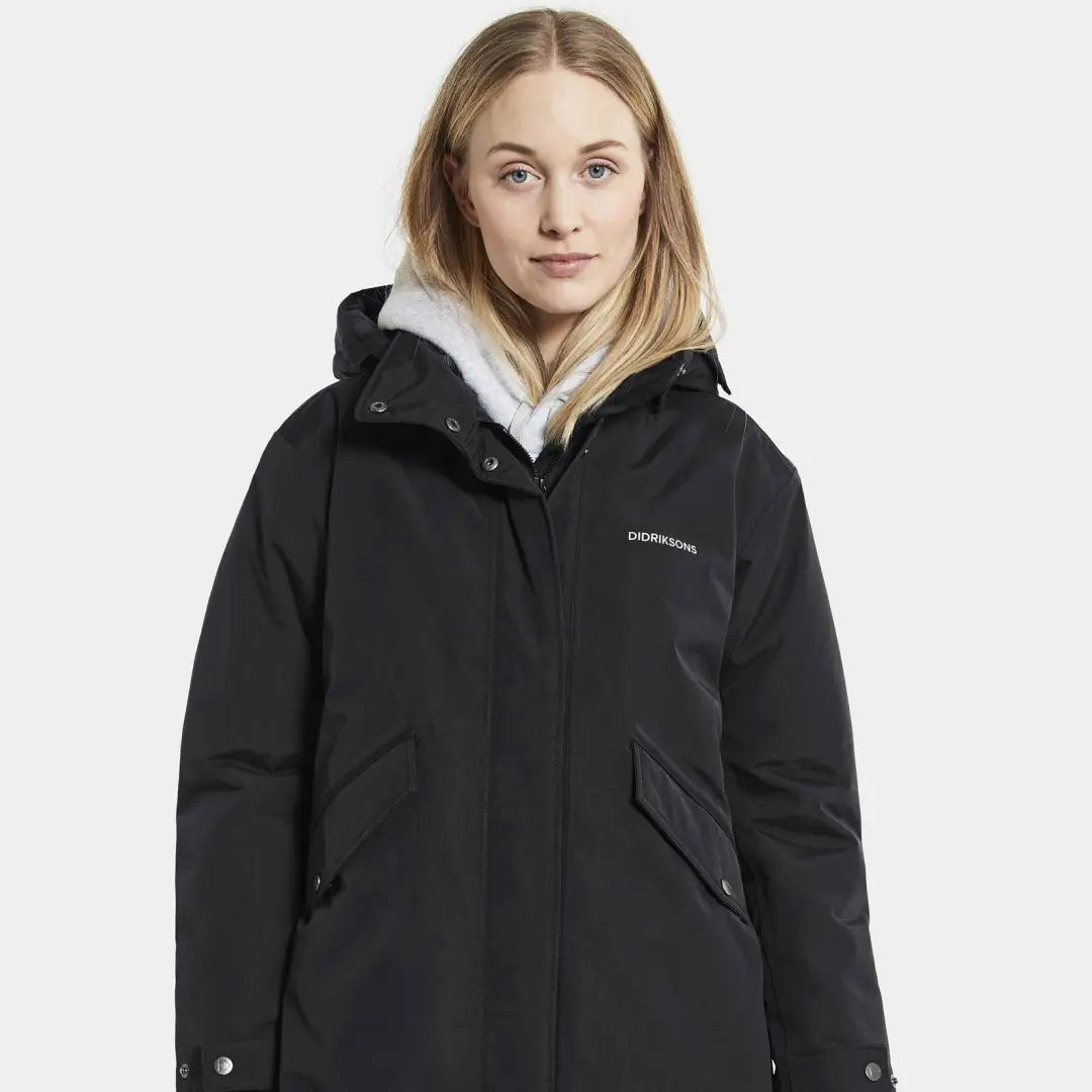 Black Didriksons Josefine Womens Parka with hood and white lining for longer jacket lifespan