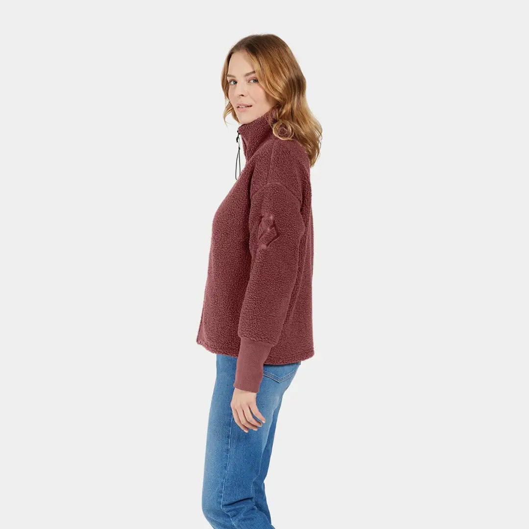 Woman styling a Burgundy turtleneck sweater for autumn’s crisp winds with jeans