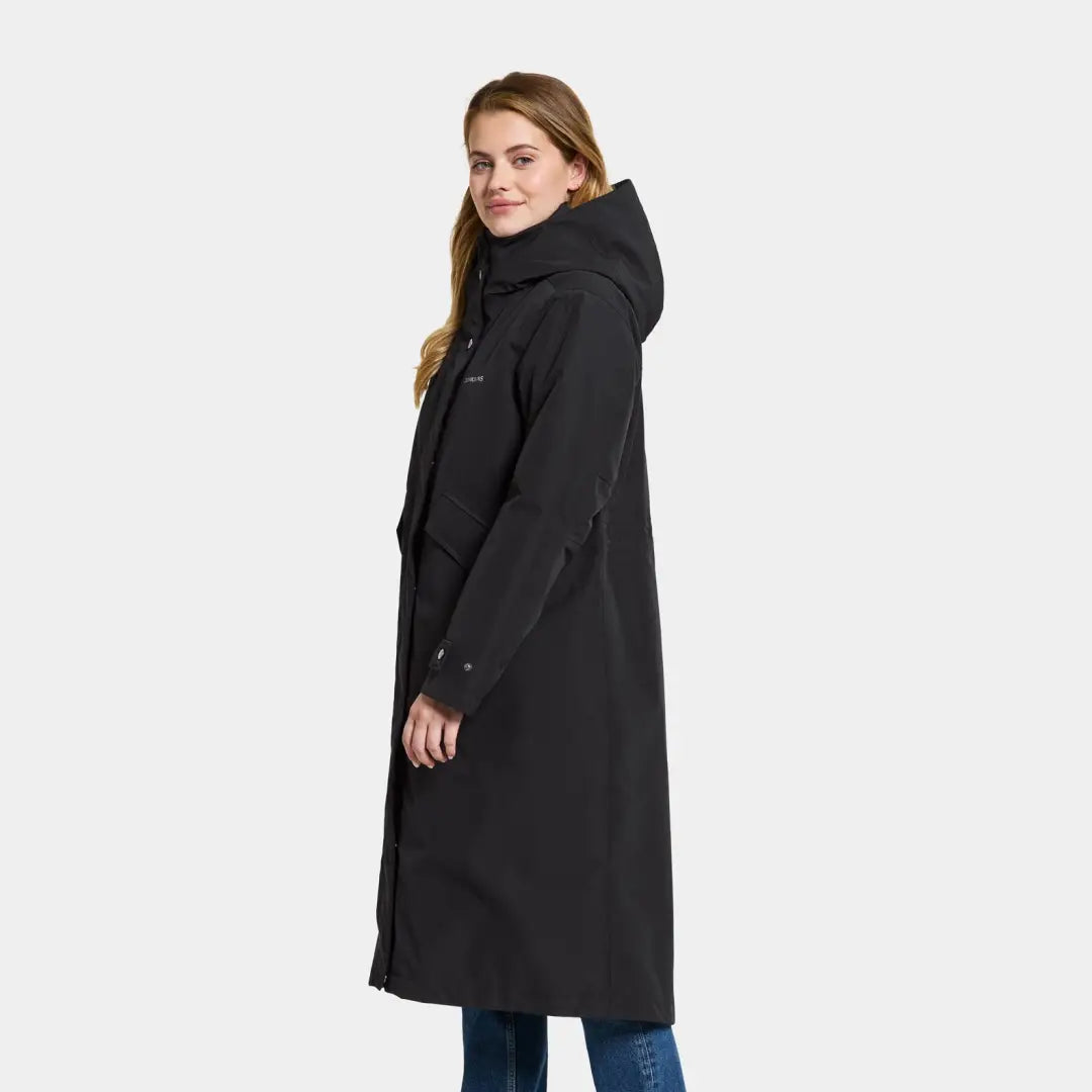 Woman wearing Didriksons Mia Long Womens Parka, a stylish long everyday parka