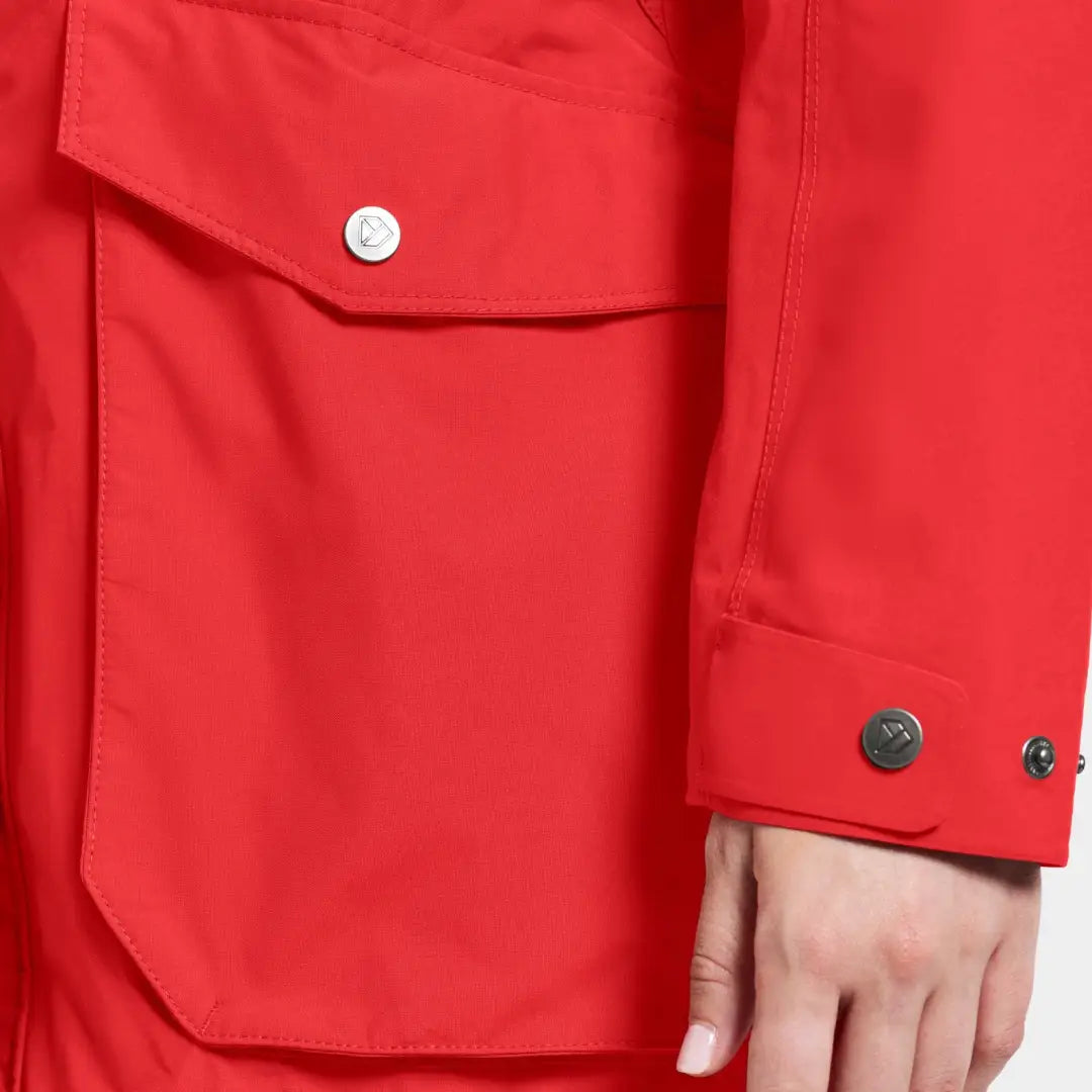 Red raincoat with pocket and buttoned cuff from iconic Didriksons Thelma Womens Parka