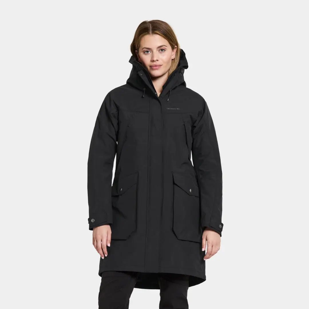 Black winter coat featuring a high collar and large pockets, fully waterproof windproof parka