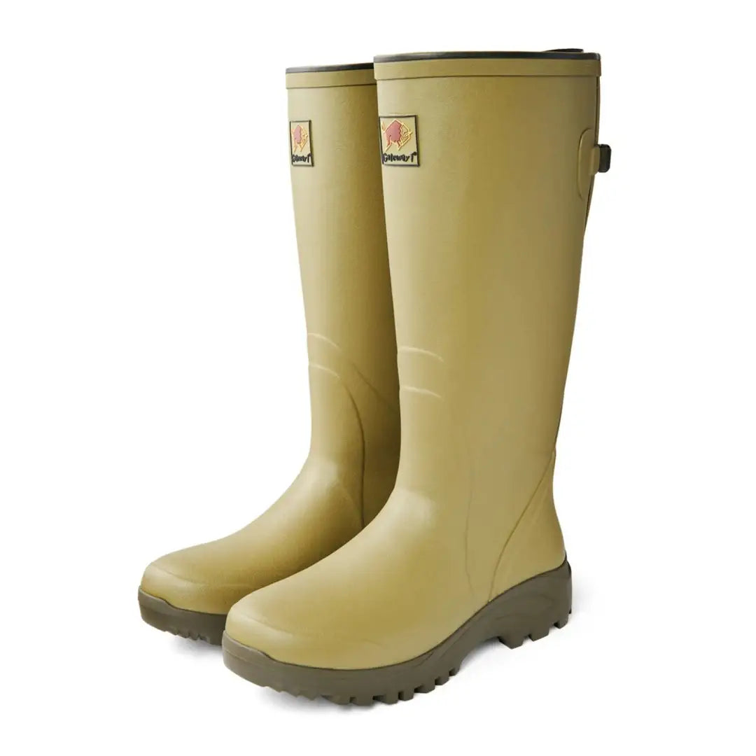 Pale yellow Gateway1 Field Master rain boots with brown soles for wet weather adventures