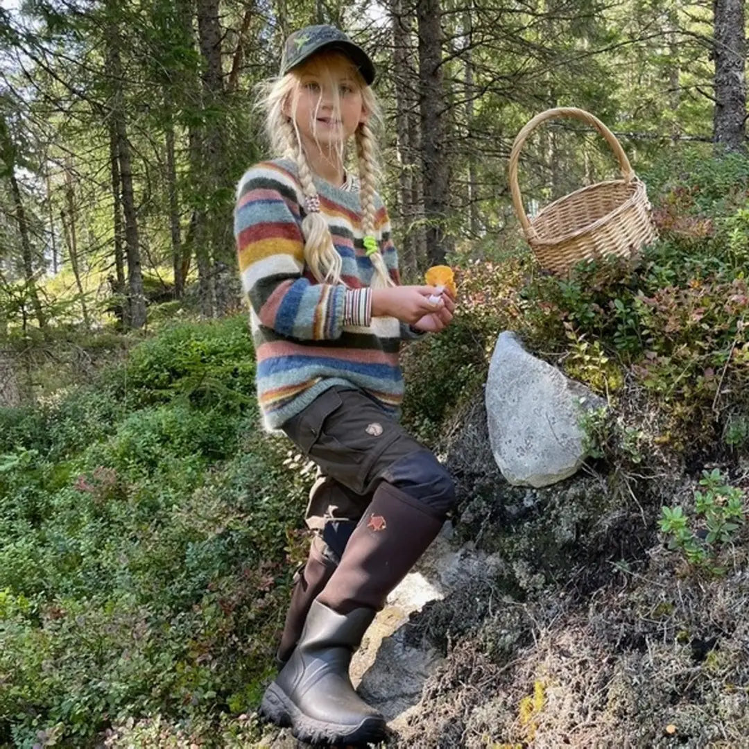 Person in a colorful striped sweater with a basket wearing Woodwalker Lady 4mm Wellington Boots