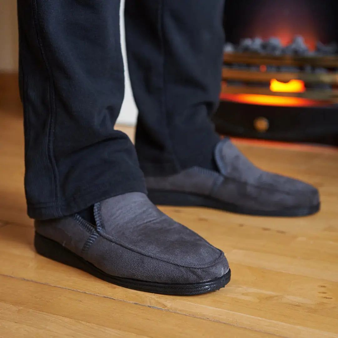 Gray suede Goodyear Eden Slippers worn on feet for a stylish, comfy look