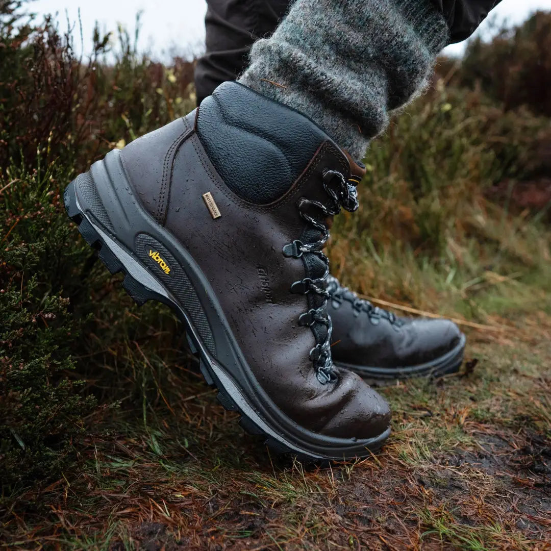 Sturdy black leather Grisport Fuse Lowland walking boots with gray wool sock showing