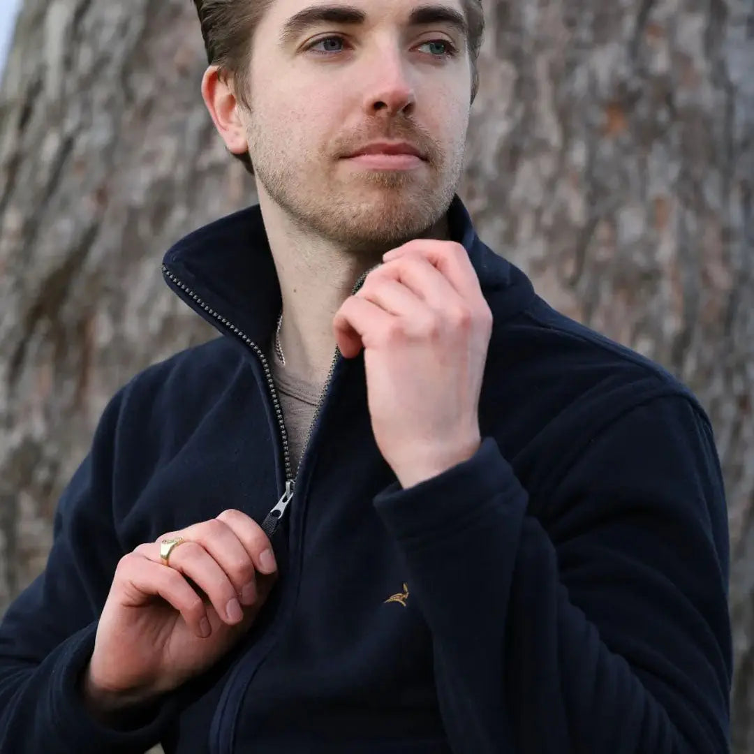 Man in a dark blue Birtles Fleece, perfect outer layer that’s fast drying