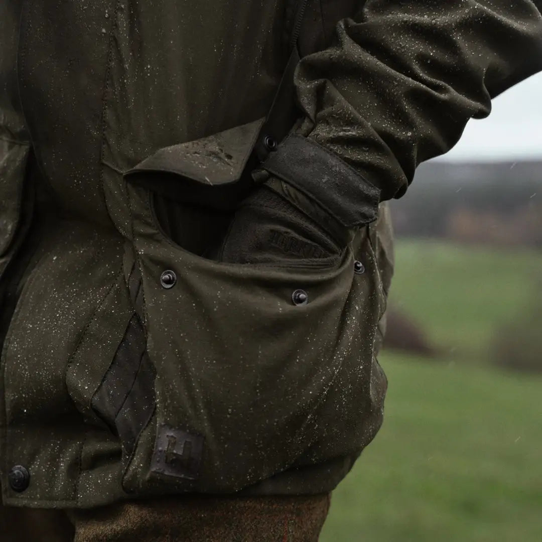 Olive green waxed jacket pocket with water droplets on Harkila Pro Hunter Shooting GTX Jacket