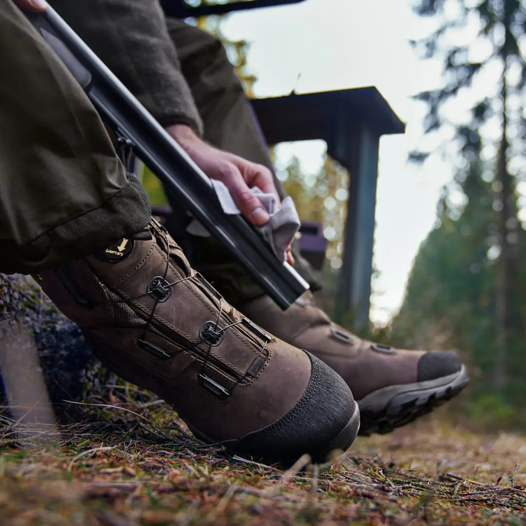 Rugged Harkila Reidmar Mid 2.0 GTX Boots with trekking pole on a hiking trail