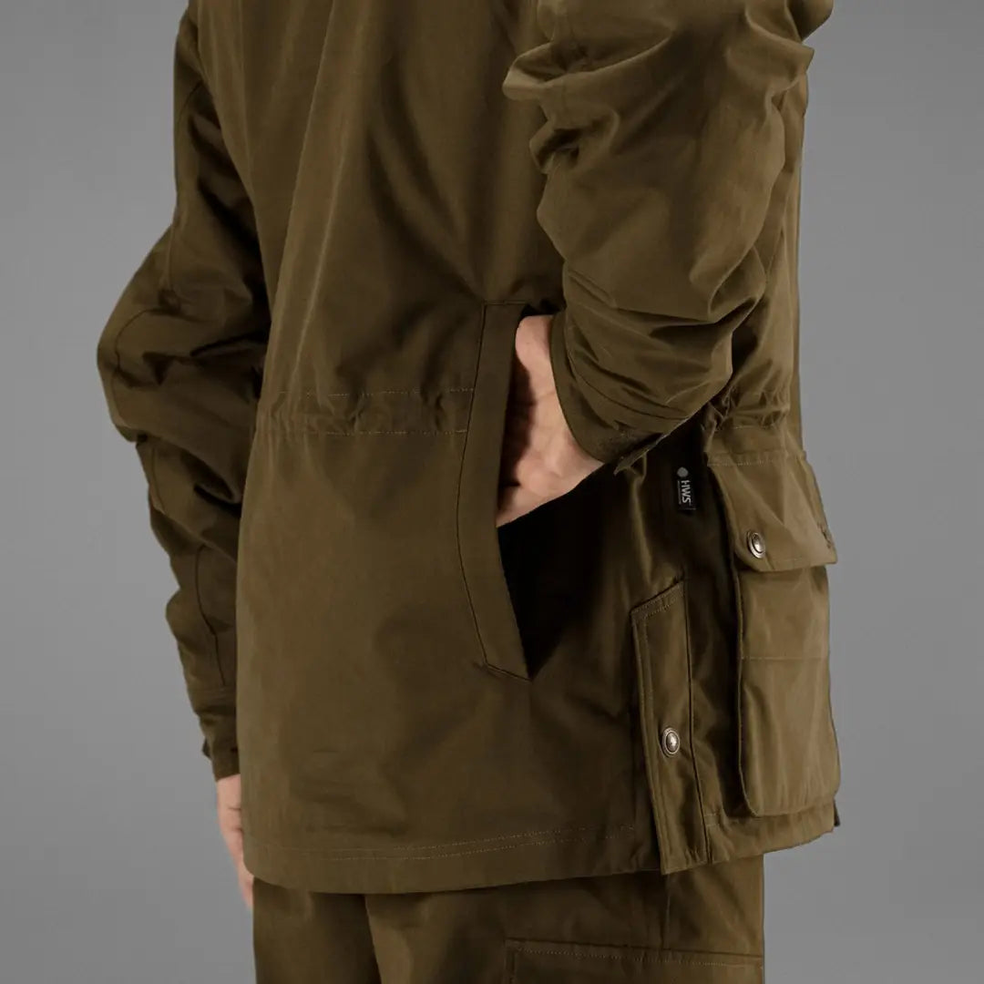 Olive green Harkila Retrieve Jacket perfect for dog handling work with multiple pockets