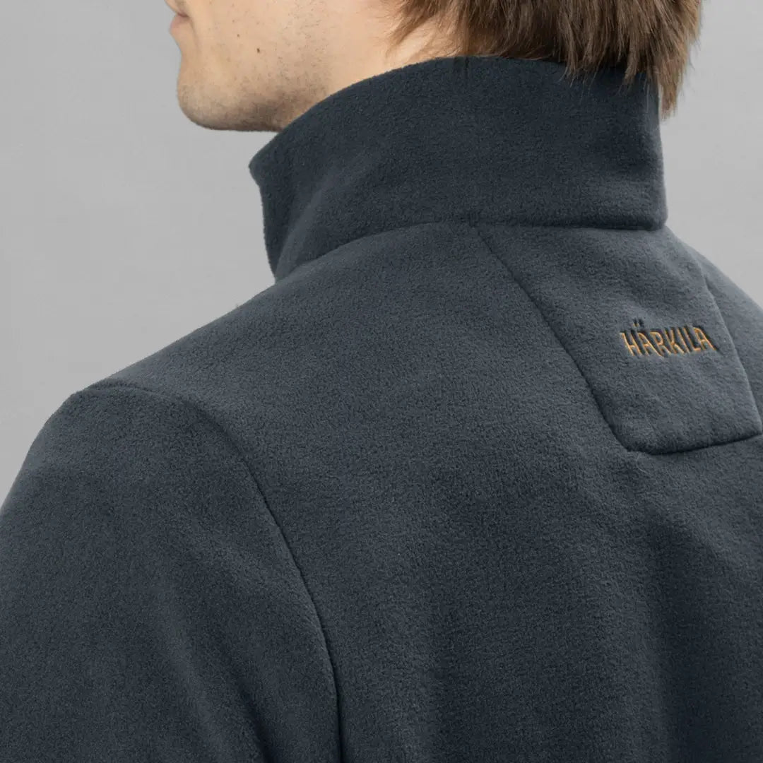 Dark gray fleece jacket with HÄRKILA logo, perfect for country clothing and hunting