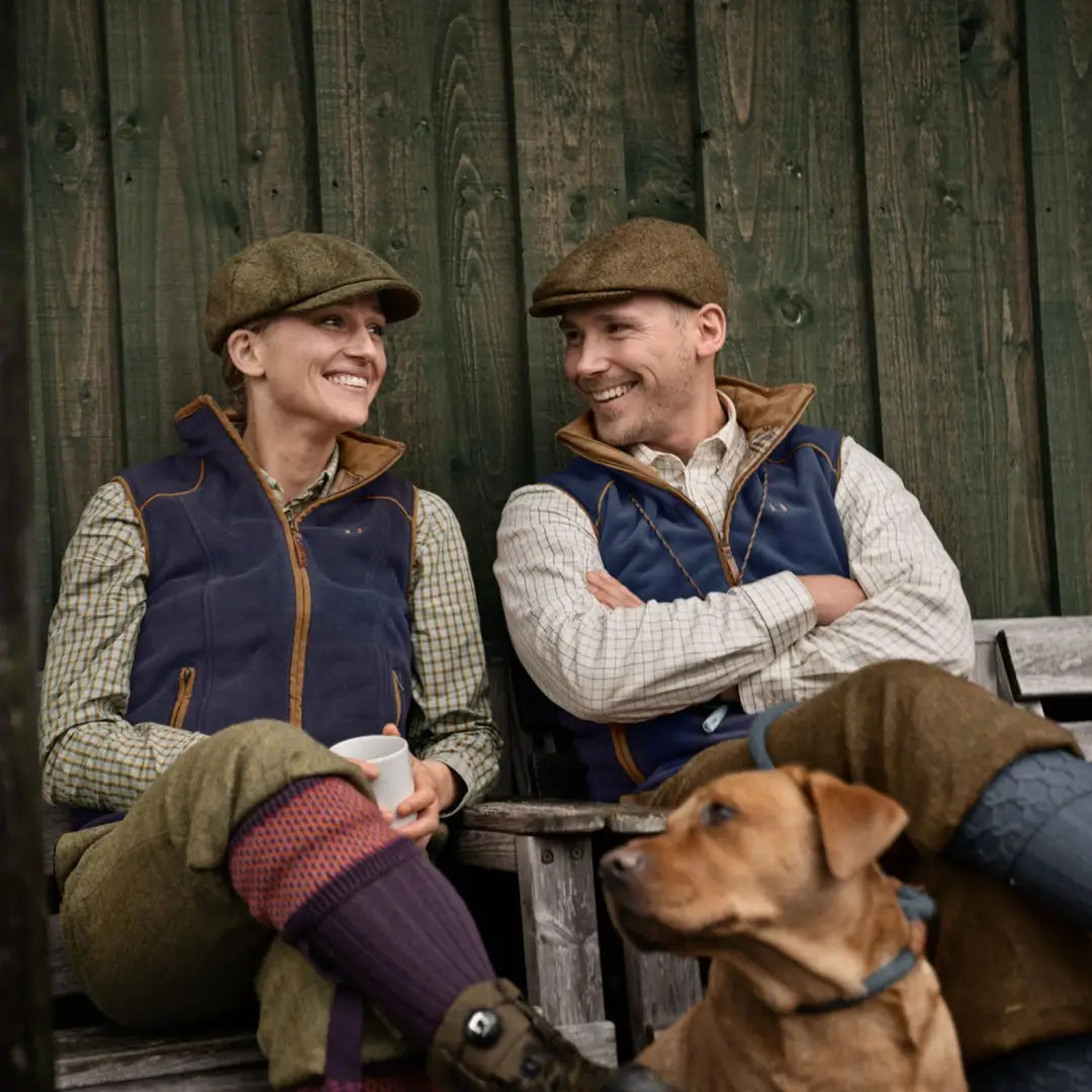 Two people and a dog enjoying the outdoors in Harkila Sandhem country clothing