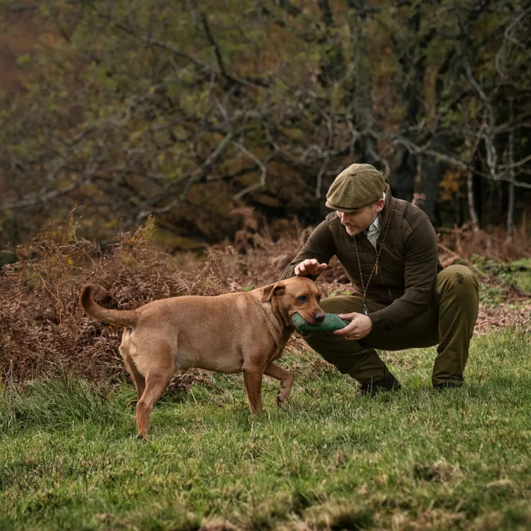 Man in countryside attire with dog wearing Sandhem Pro Insulated Cardigan outside