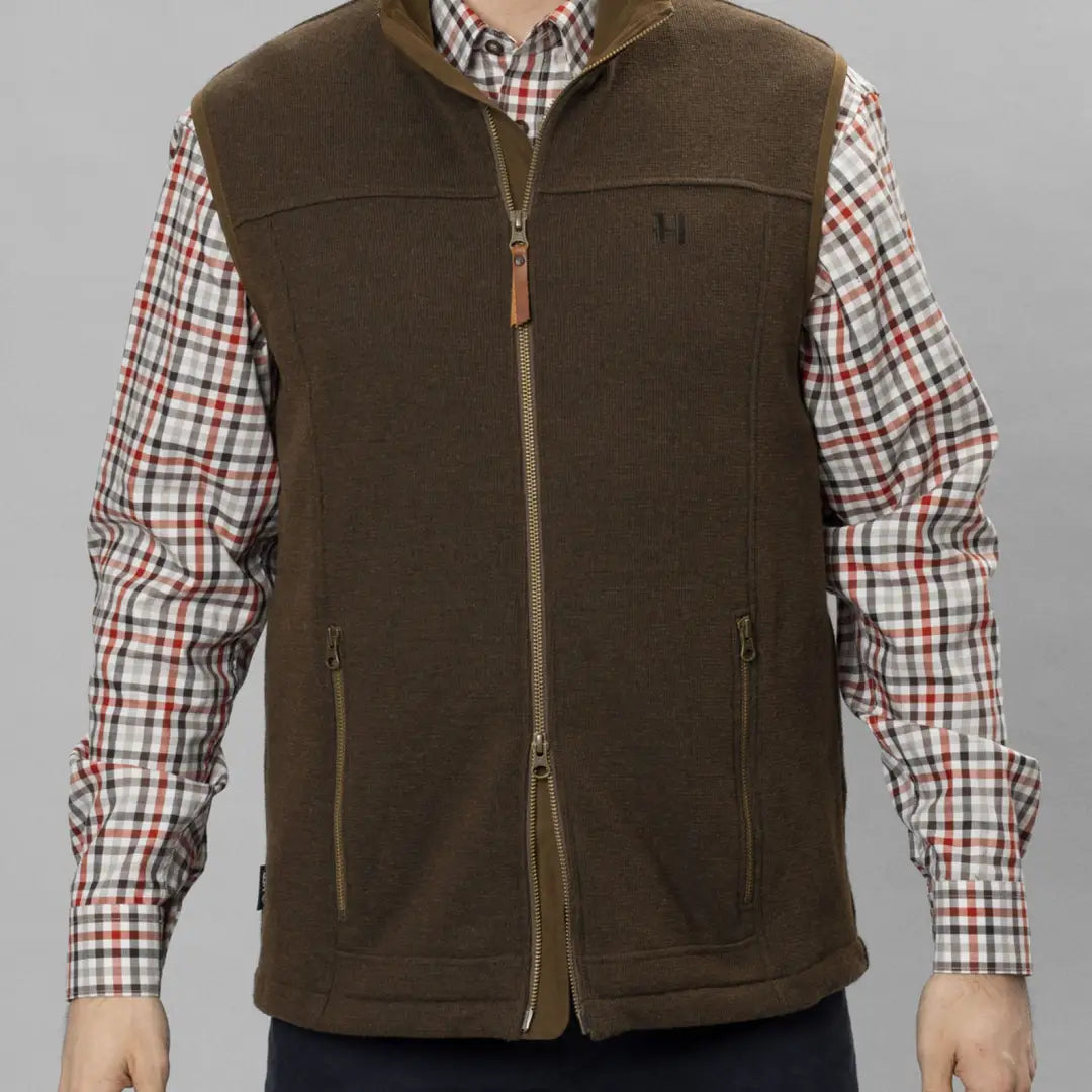 Brown fleece Harkila Sandhem Pro Waistcoat over a plaid shirt, perfect for outdoor adventures