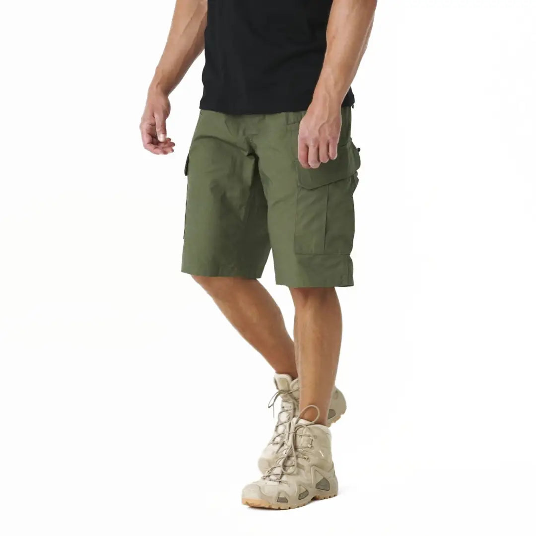 Olive green Helikon-Tex Polycotton Ripstop CPU Shorts worn casually by a person