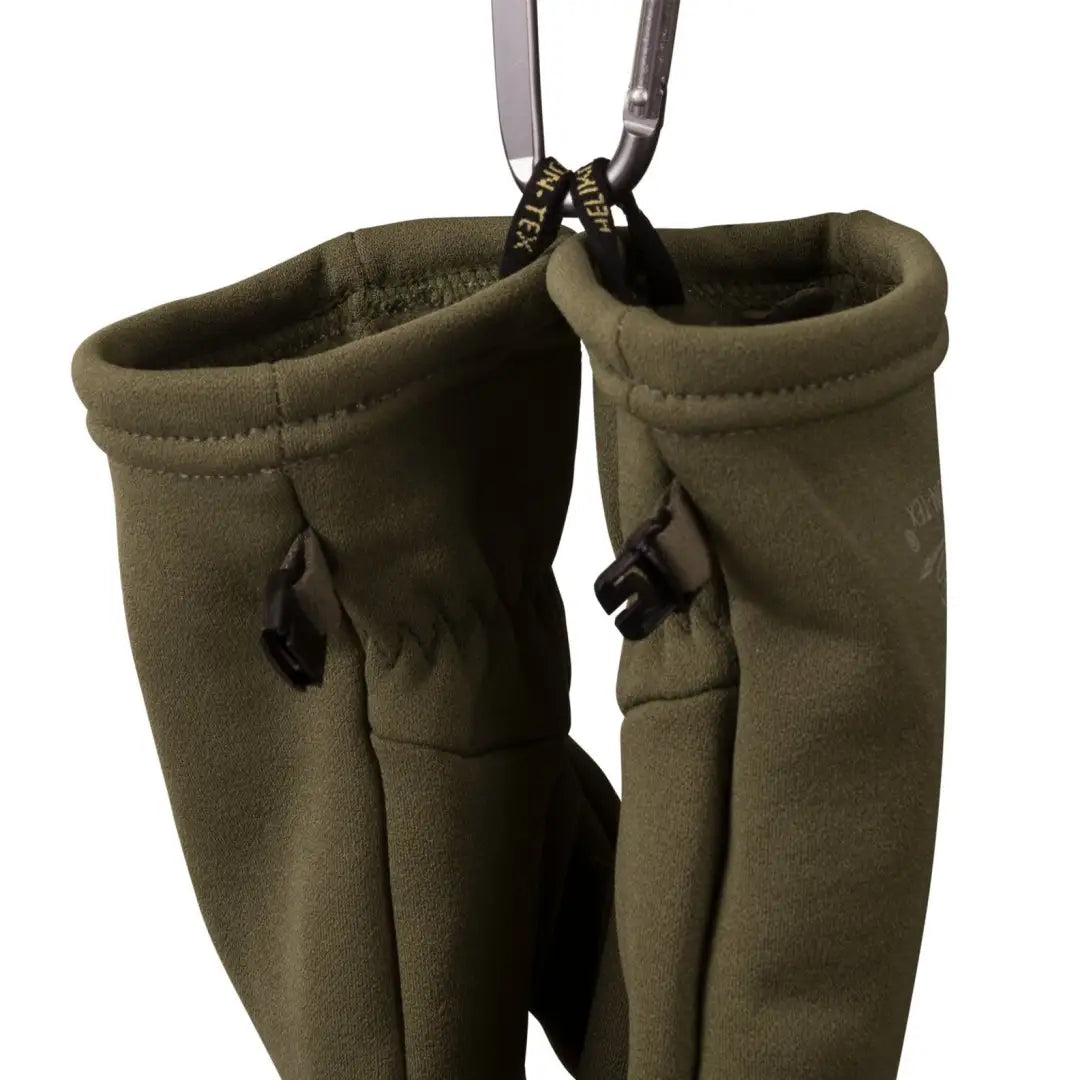 Olive green neoprene fishing waders hanging, perfect with Trekker Outback Gloves