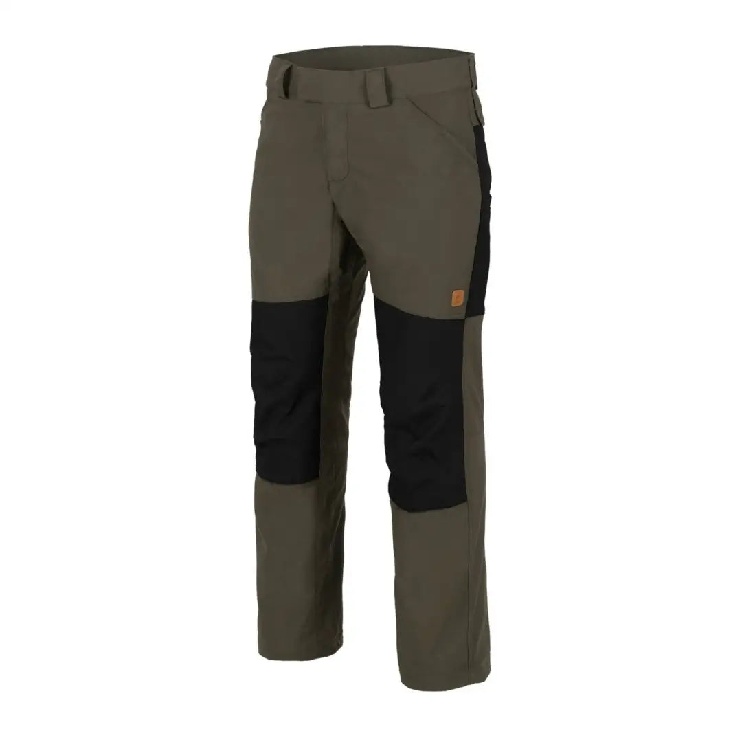 Olive green Helikon-Tex Woodsman Pants with black knee patches for outdoor enthusiasts