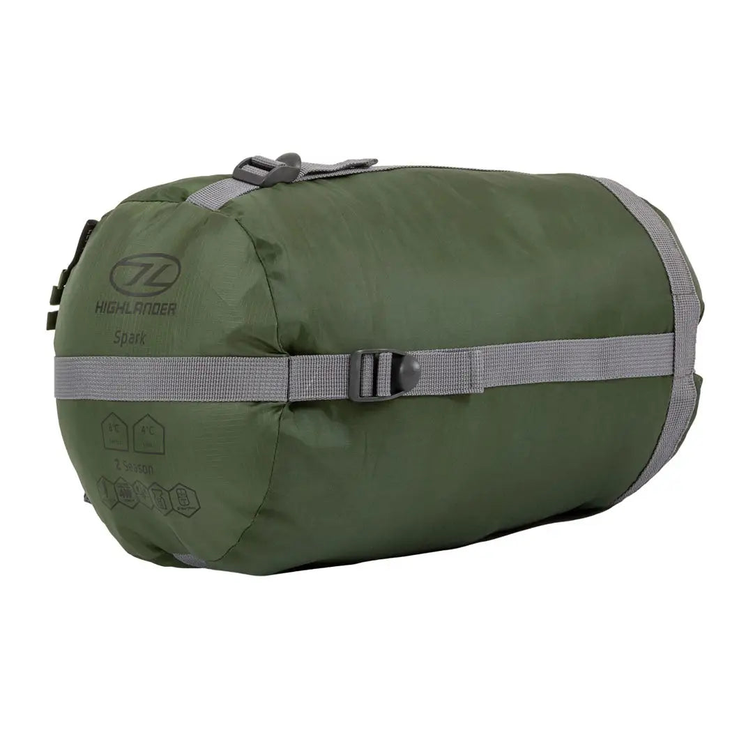 Olive green Highlander Phoenix Spark 150 sleeping bag with gray straps for two season camping